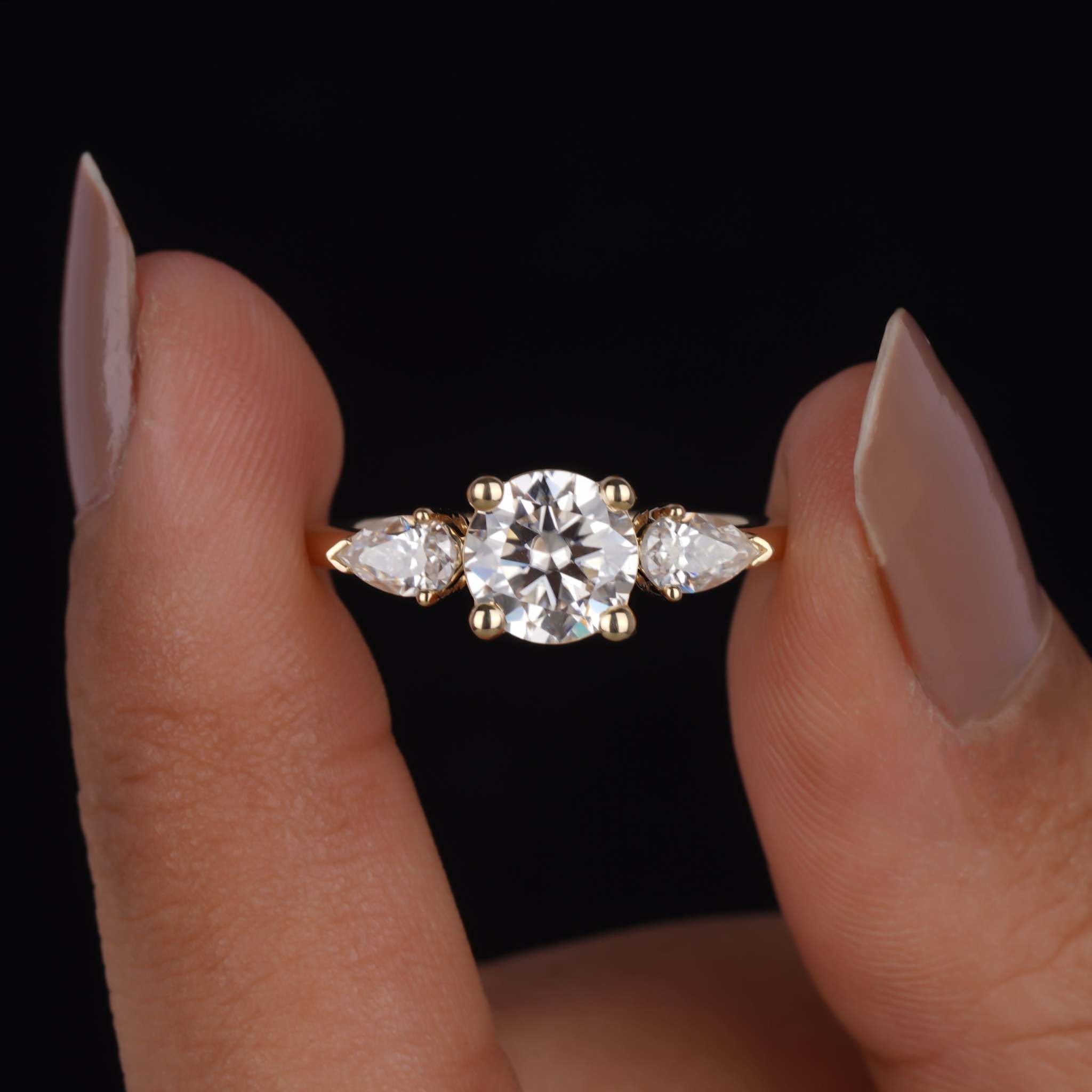 1.35 TCW Round and Pear Cut Moissanite Three Stone Engagement Ring